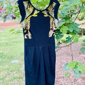 XOXO black minidress with sequin trim.